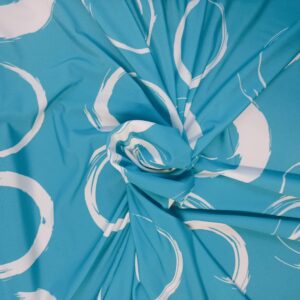 Lycra leggera con stampa cerchi su fondo verde